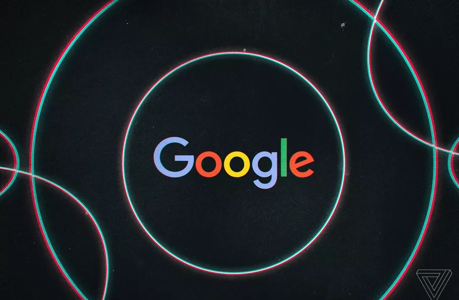 A black background that reads Google in the centre surrounded by colourful rings,