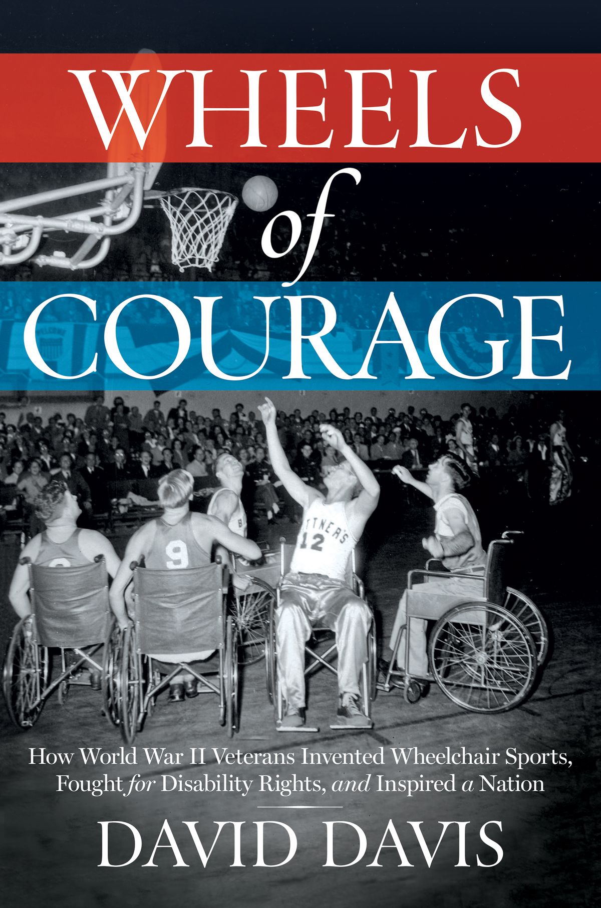 Image is a book cover. The words Wheels of Courage appear of red and blue bands of colour on top of a old 1950s-era picture of 5 young white men in wheelchairs crowded under a basketball hoop. The athletes wear the jerseys of two opposing teams. One player in the foreground has his arms extending, having just tossed a basketball towards the hoop while his teammates watch excitedly. Spectators seated in stands are visible in the background of the photograph. On the bottom of the photograph is text reading: H