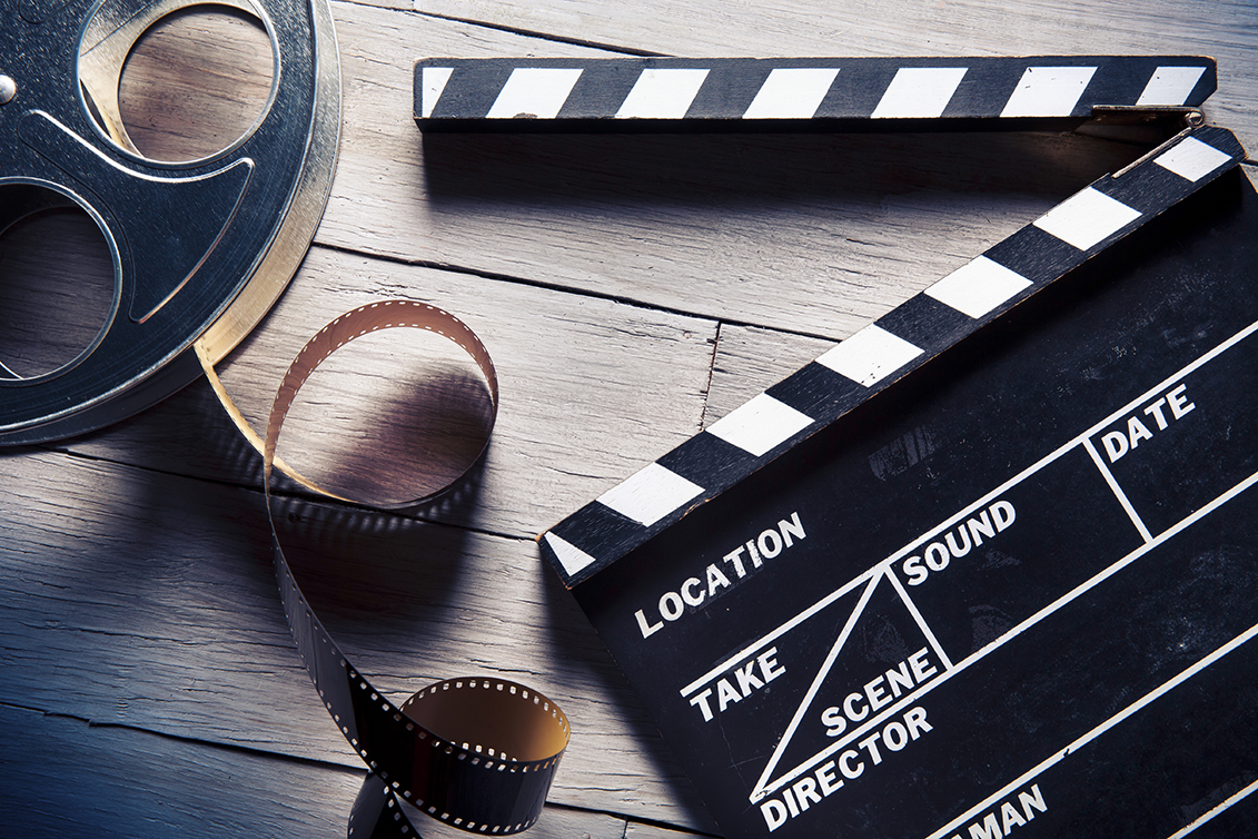 A movie tape roll and a snap stick