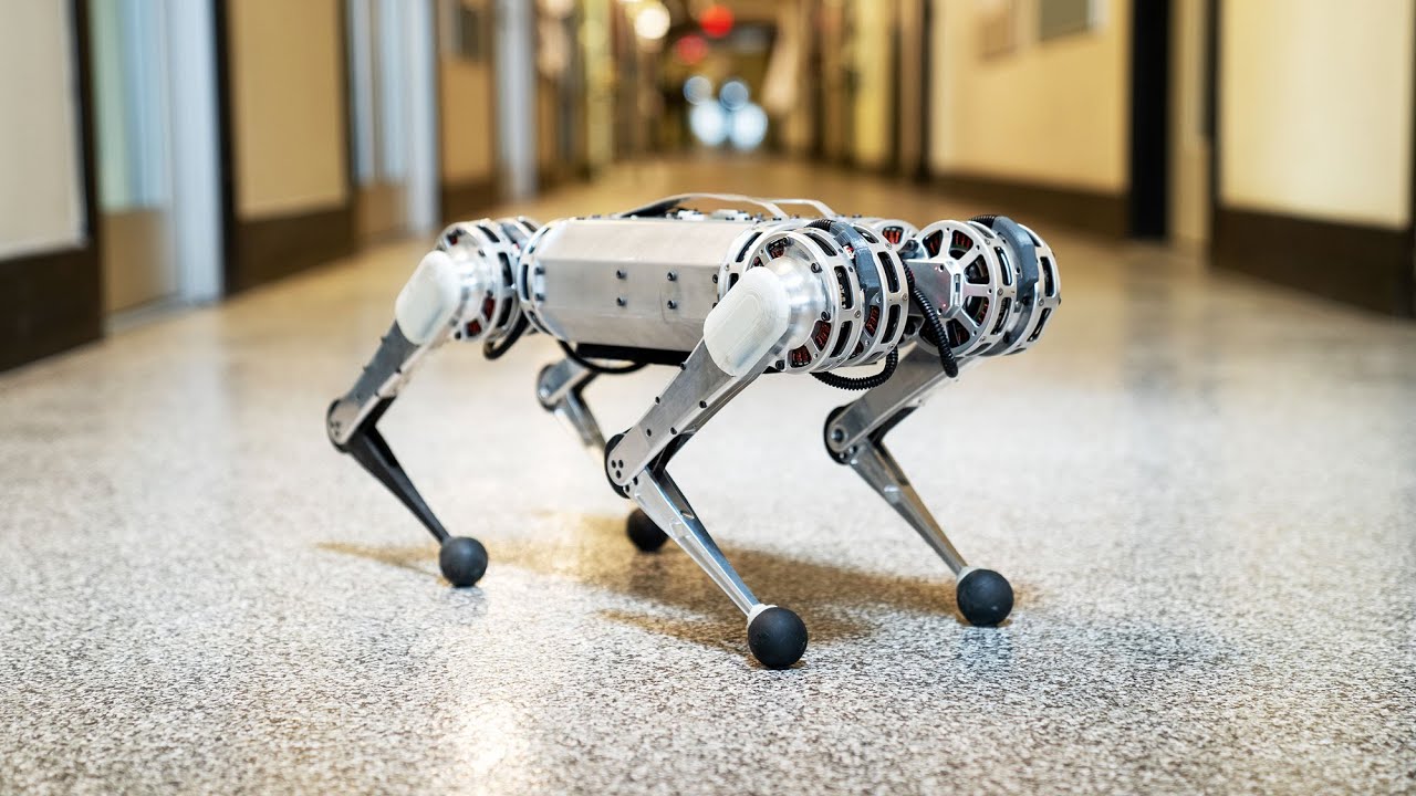 A four-legged dog-like metal robot without a head and with various sensors and camera on it. 