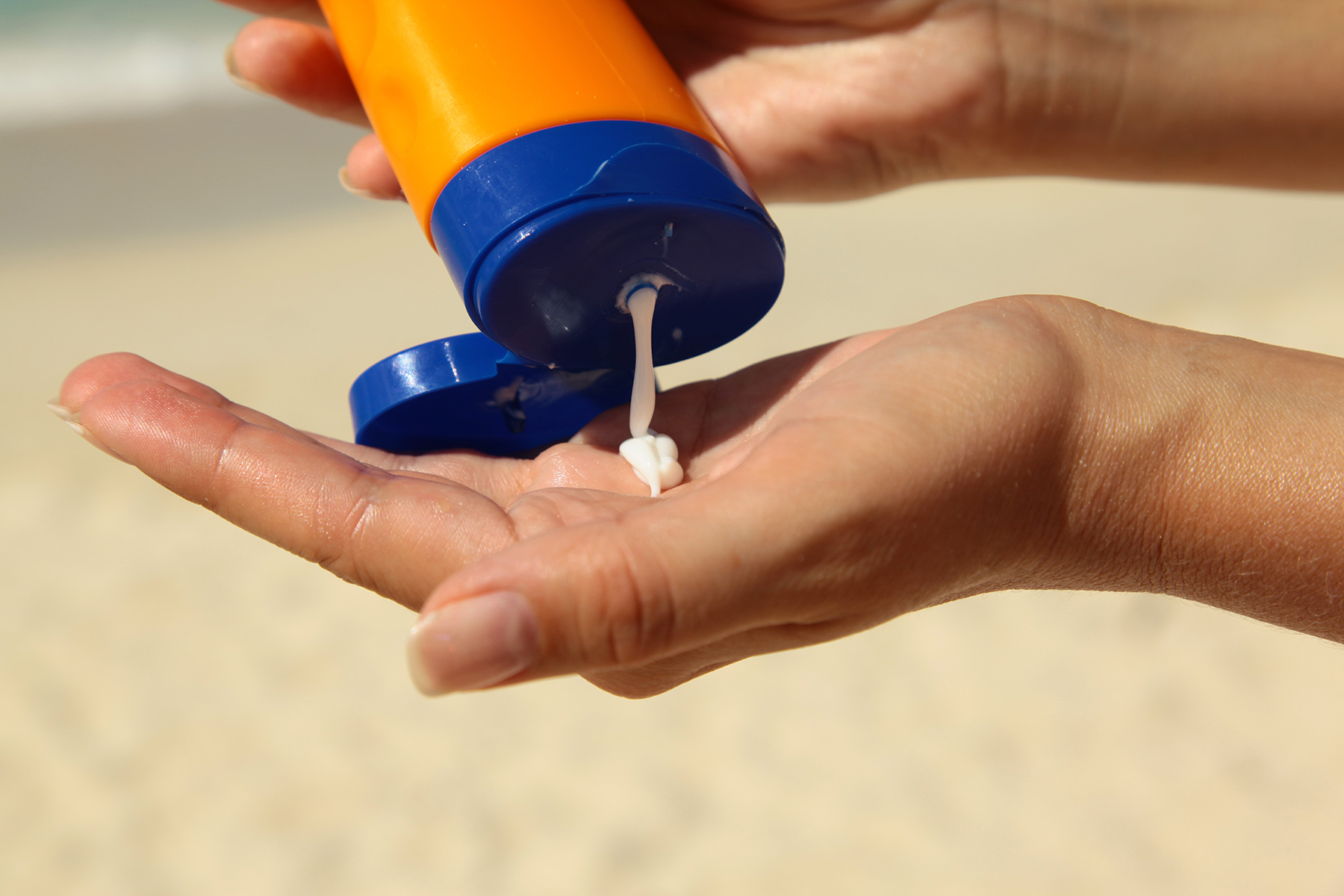 Someone applying sunscreen