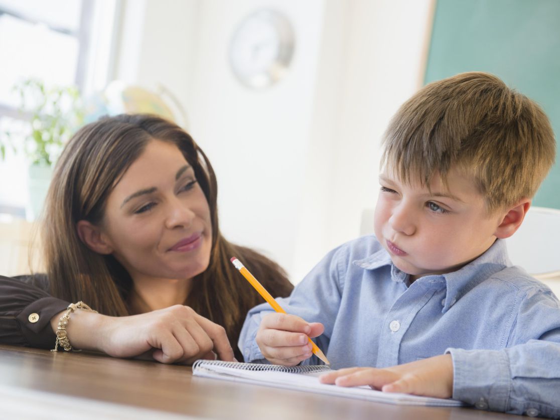 A teacher and a student solving a problem