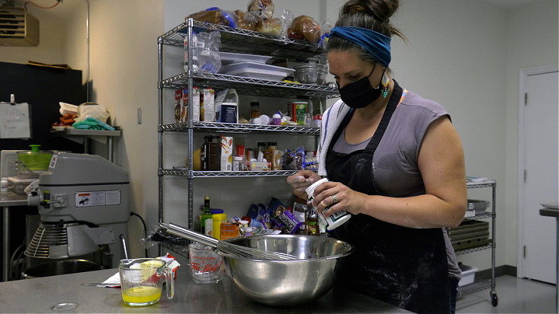 Jenna White works in her business kitchen