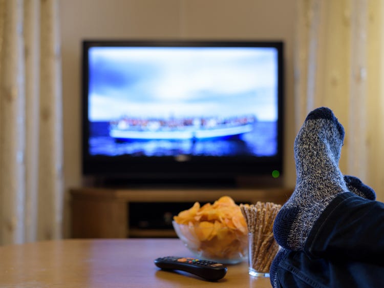A person watching TV