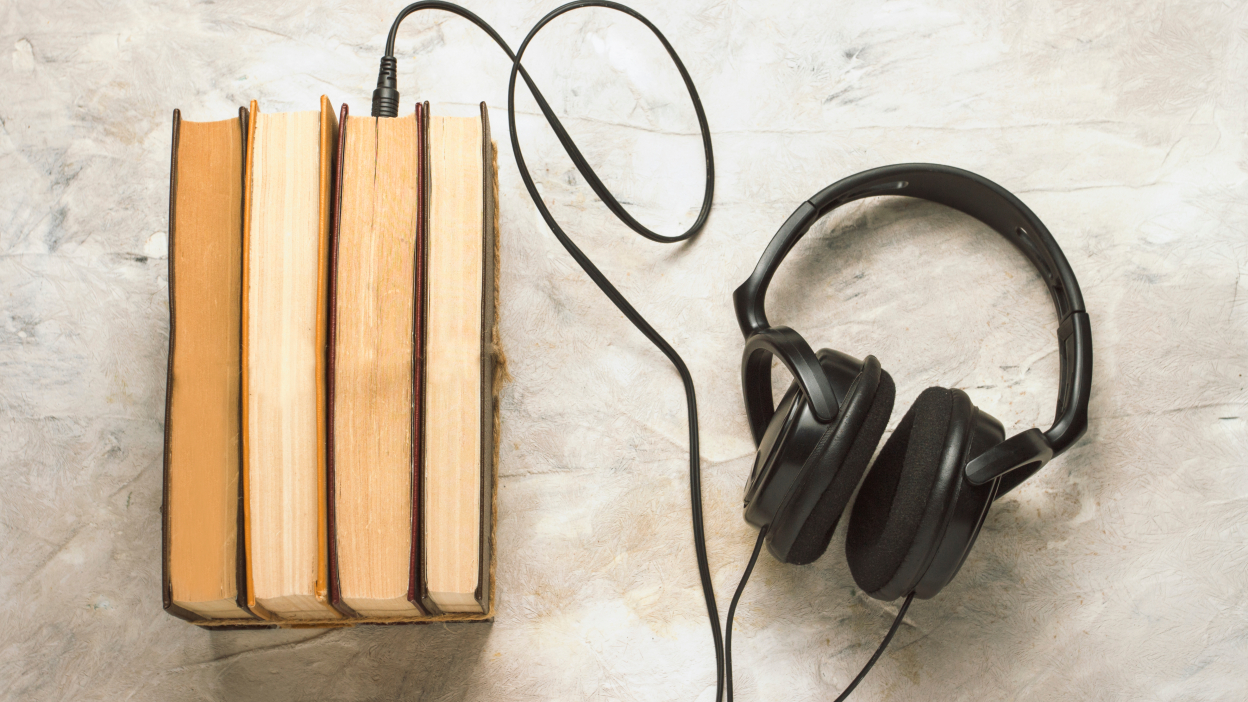 Books with headphones plugged in