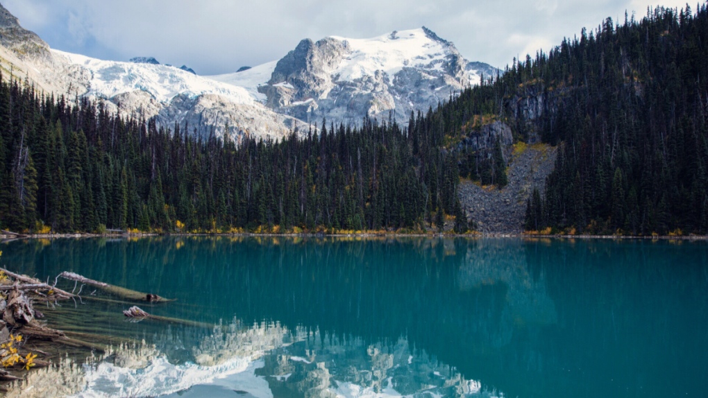 A park in BC with a beautiful mountain and lake