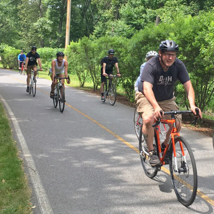 A group riding bikes on a path