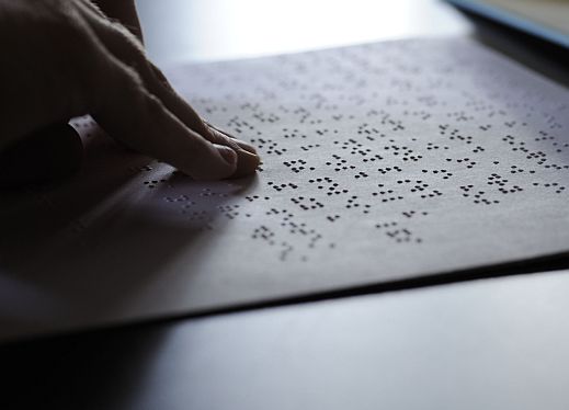 A person using braille