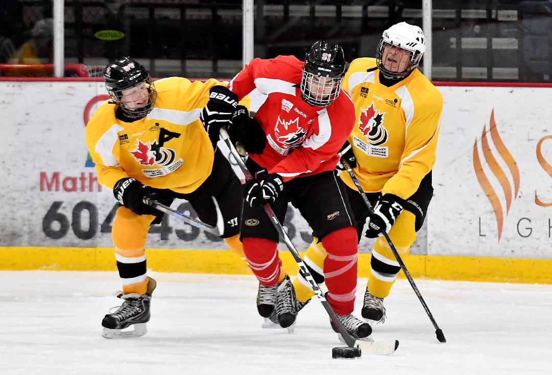 3 blind hockey players battling for the puck
