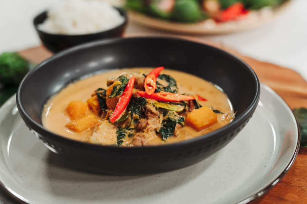A bowl of red curry pork