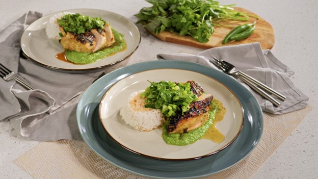 Thai Chicken Marinade, served on rice, on a plate.