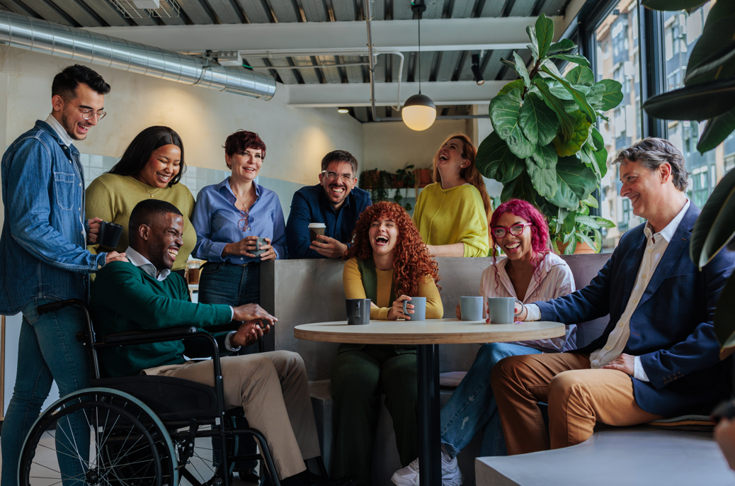 A diverse group of people around a table.