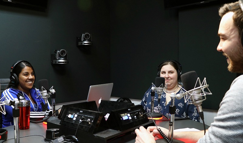 Amy Amantea sits in a radio studio.