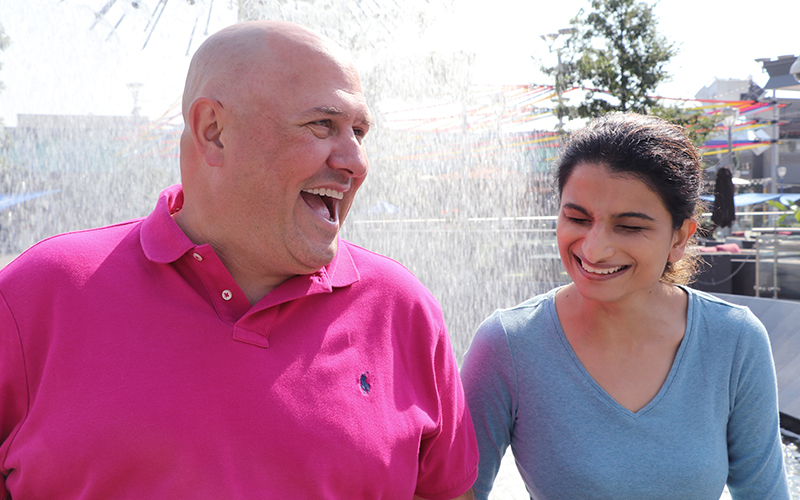 Mike and Joeita, hosts of Live from Studio 5 smiling outside 