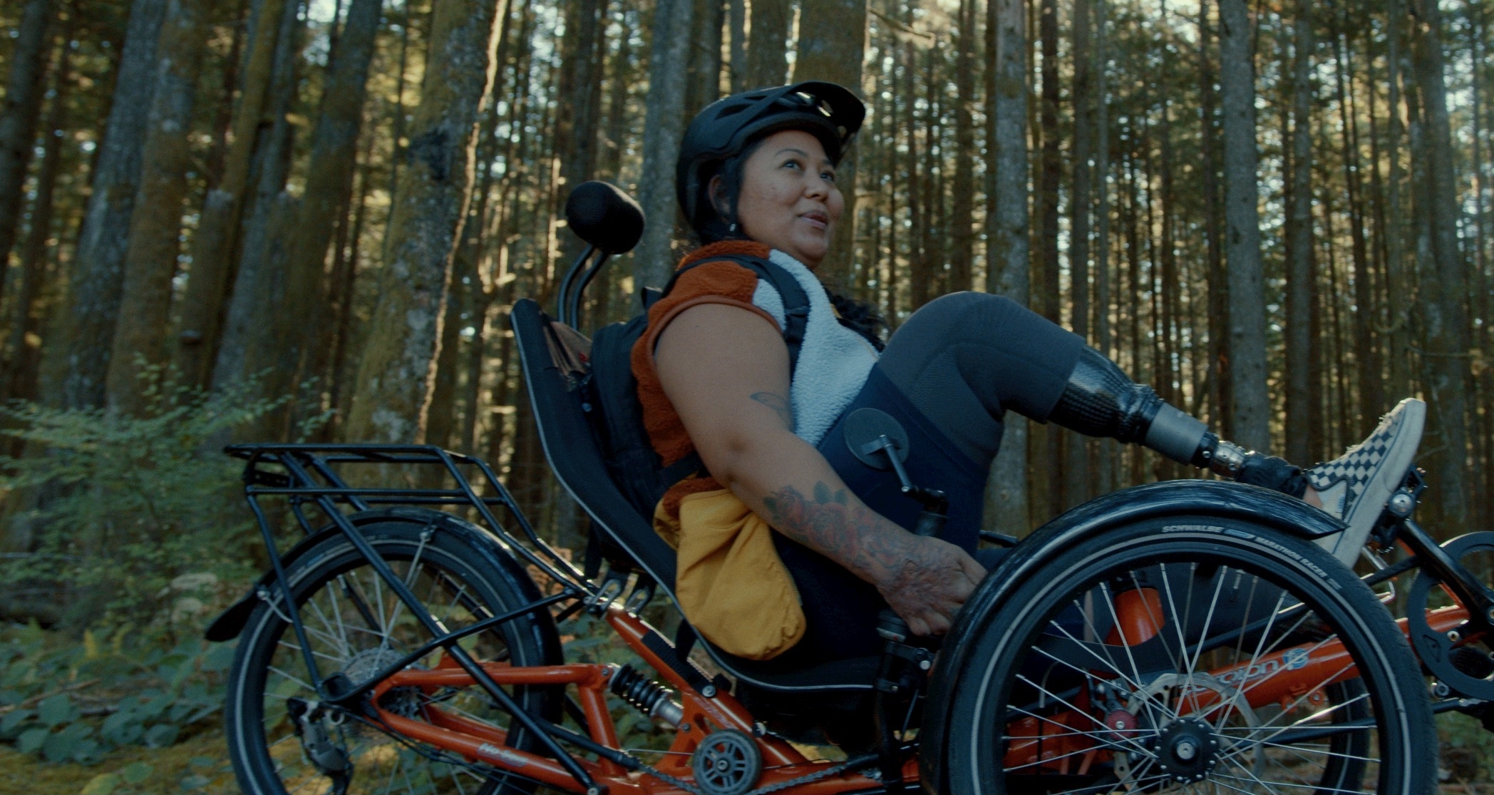 Therese Estacion sits on an adaptive bike.